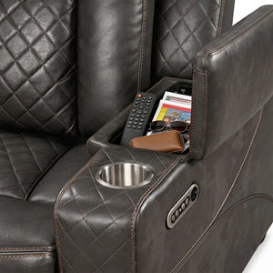 Eloise Power Gray Recliner Sectional Sofa LED Multi Color Lights Close-up of a dark brown quilted leather recliner chair with a cup holder and side storage compartment holding a remote, magazine, and sunglasses.