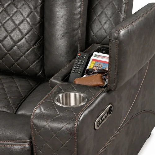 Eloise Power Gray Recliner Sectional Sofa LED Multi Color Lights Close-up of a dark brown quilted leather recliner chair with a cup holder and side storage compartment holding a remote, magazine, and sunglasses.