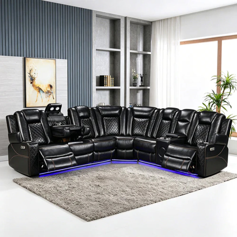 Eloise Power Recliner Sectional Sofa LED Multi Color Lights A black leather sectional sofa with quilted backrests, built-in side tables, and blue LED underglow, shown in a modern living room setting on a gray shag rug.