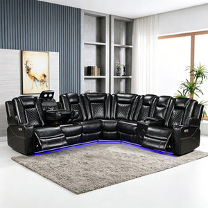 Eloise Power Recliner Sectional Sofa LED Multi Color Lights A black leather sectional sofa with quilted backrests, built-in side tables, and blue LED underglow, shown in a modern living room setting on a gray shag rug.