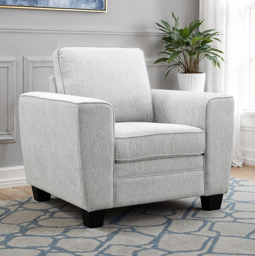 Erna Light Gray Chenille Fabric Chair Gray armchair in a living room setting with a plant and patterned rug.