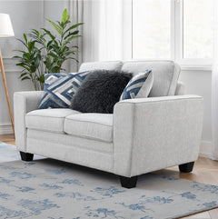 Erna Light Gray Chenille Fabric Loveseat Gray sofa with decorative pillows in a living room setting