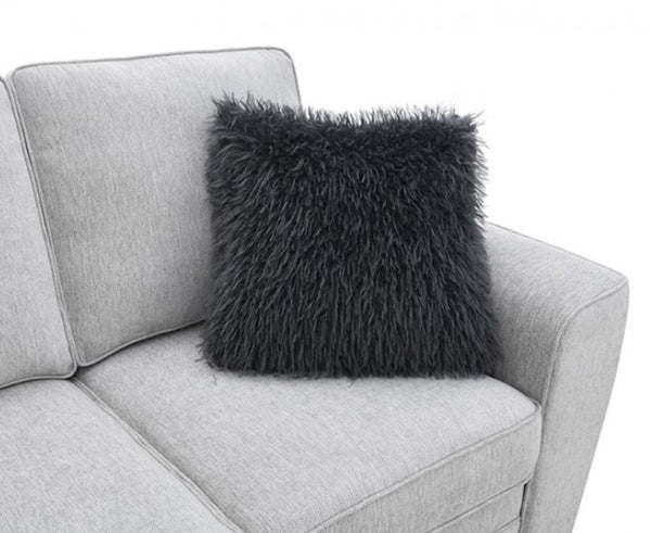 Erna Light Gray Chenille Fabric Sofa Black fluffy pillow on a gray sofa