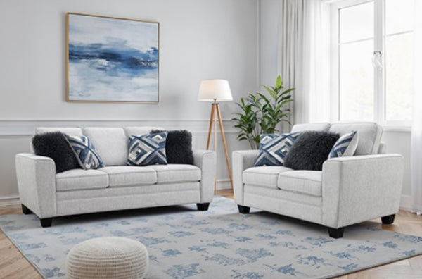 Erna Light Gray Chenille Fabric Sofa Living room with white sofa set, decorative pillows, and a rug.
