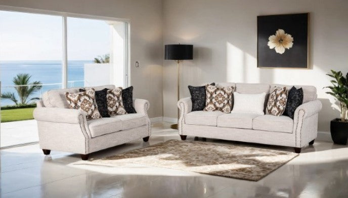 Erni Light Gray Fabric Accent Chair With Pillows Patterned armchair with a dark pillow against a neutral wall.