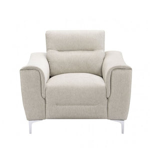 Estrella Light Taupe Brown Slope Flair Arm Chair A modern upholstered armchair in a light beige textured fabric, featuring a high back, wide armrests, and slim white metal legs, shown against a plain white background.