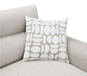 Estrella Light Taupe Brown Slope Flair Arm Loveseat A square throw pillow with a white and light beige geometric pattern, resting on a light gray fabric sofa against a white background.