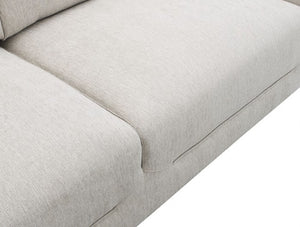Estrella Light Taupe Brown Slope Flair Arm Loveseat Close-up of a light beige textured fabric sofa cushion with clean stitching and a white background.
