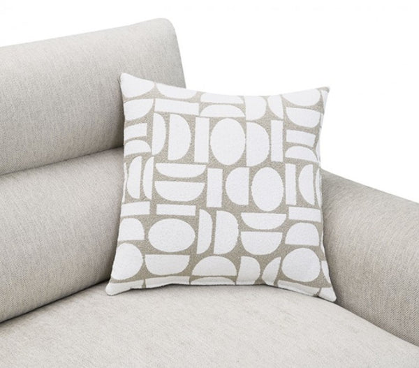 Estrella Light Taupe Brown Slope Flair Arm Sofa A square throw pillow with a white and beige geometric pattern, resting on a light gray fabric sofa against a white background.