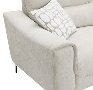 Estrella Light Taupe Brown Slope Flair Arm Sofa Close-up of a light beige upholstered sofa arm with a patterned accent pillow in white and beige, shown on a white background.