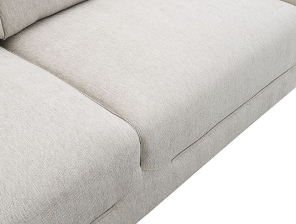 Estrella Light Taupe Brown Slope Flair Arm Sofa Close-up of a light beige textured fabric sofa cushion with clean stitching and a matching upholstered side arm, shown against a white background.