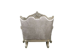 Ethaan Button Tufted Traditional Fabric Chair A single upholstered armchair shown from the back, featuring a silver damask-patterned fabric and ornate silver carved wooden arms and legs, isolated on a white background.
