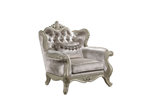 Ethaan Button Tufted Traditional Fabric Chair An ornate vintage-style armchair with tufted velvet upholstery in a light silver-gray color and carved wooden arms and legs in a matching silver finish, shown against a plain white background.