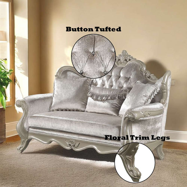 Ethaan Button Tufted Traditional Fabric Loveseat Silver button tufted sofa with floral trim legs in a room setting.