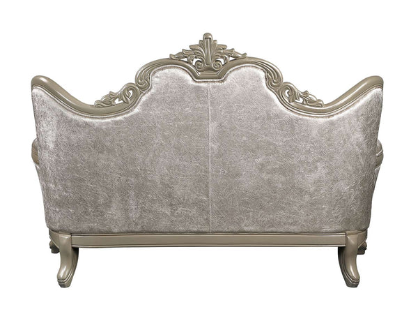 Ethaan Button Tufted Traditional Fabric Loveseat An ornate upholstered loveseat or sofa shown from the back, featuring a silver-gray textured velvet fabric and a carved light wood frame with decorative scrollwork and curved arms.
