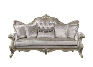 Ethaan Button Tufted Traditional Fabric Sofa A classic French-style loveseat sofa upholstered in a textured champagne gray velvet fabric, featuring a carved silver-painted frame and matching decorative throw pillows.