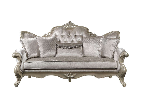 Ethaan Button Tufted Traditional Fabric Sofa A classic French-style loveseat sofa upholstered in a textured champagne gray velvet fabric, featuring a carved silver-painted frame and matching decorative throw pillows.