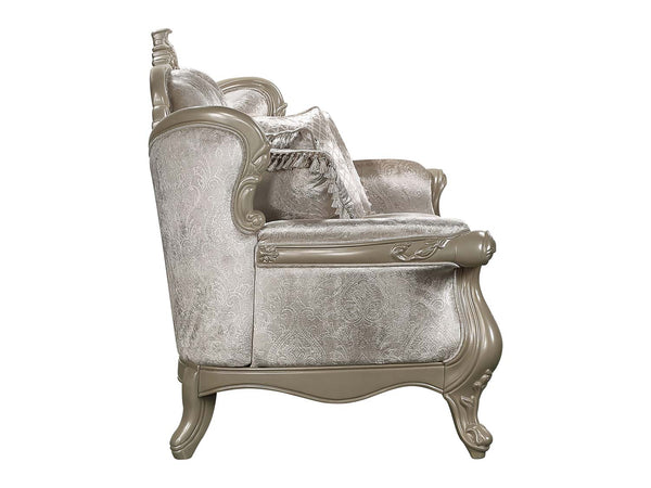 Ethaan Button Tufted Traditional Fabric Sofa An ornate vintage-style armchair with a distressed silver-gray velvet upholstery and a matching decorative pillow, set against a plain white background.
