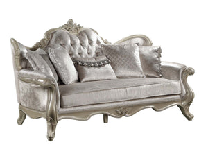 Ethaan Button Tufted Traditional Fabric Sofa An ornate silver velvet loveseat sofa with carved wood arms and legs, featuring tufted back cushions and matching decorative pillows, shown against a plain white background.