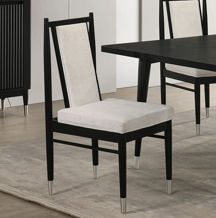 Dining chair with black frame and white cushion on a wooden floor.