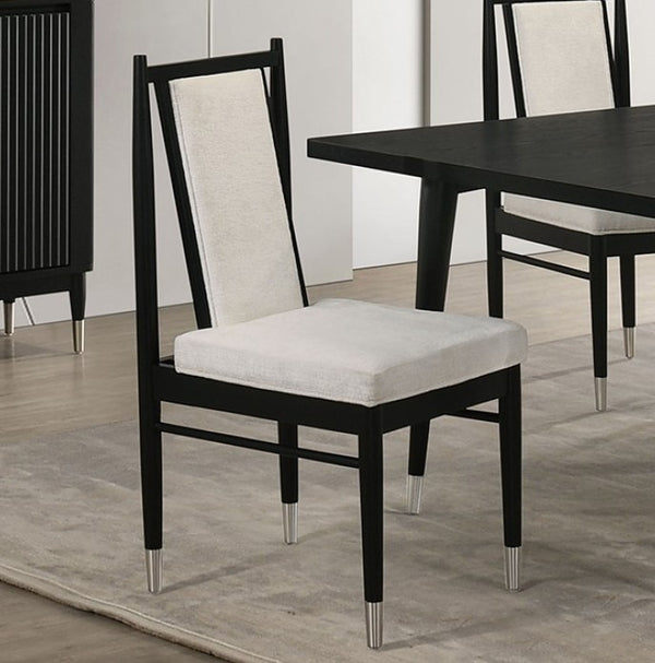 Dining chair with black frame and white cushion on a wooden floor.