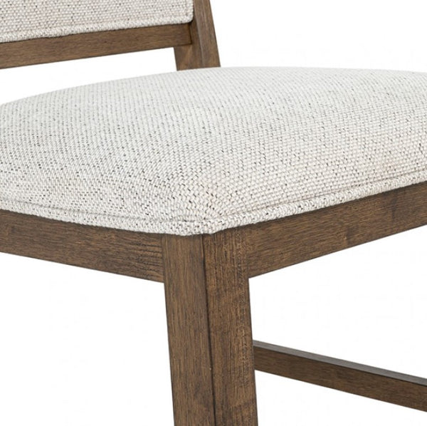 Ezera Dark Walnut Dining Chair Close-up of a wooden chair with a white cushioned seat on a white background