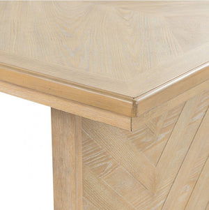 Ezera Natural Extendable Dining Table Close-up of a wooden table with a chevron pattern on a white background