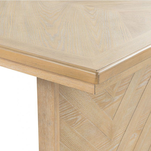 Ezera Natural Extendable Dining Table Close-up of a wooden table with a chevron pattern on a white background