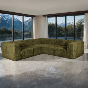#Green Giacinto Compressed Foam Modern L-Sectional Sofa Green Finish Green sectional sofa in a modern room with large windows and mountain views.