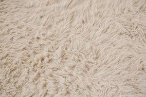 #sand  Giacinto Compressed Foam Modern L-Sectional Sofa Sand Finish Close-up of a beige, textured fabric surface
