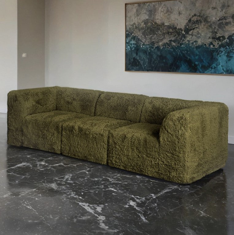 Giacinto Compressed Foam Modern Sofa Olive Green Finish Green textured sofa in a room with a marble floor and abstract painting on the wall.
