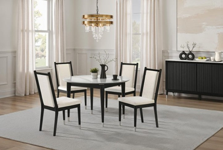 Grayson Contemporary Black White Fabric Chair Black dining chairs with cream upholstered seats and backrests, shown in a dining room setting next to a glass-top table.
