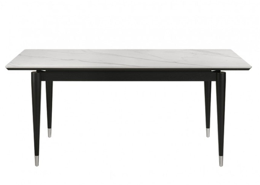 Grayson Contemporary Black White Sintered Stone Top Dining Table A 7-piece dining set featuring a rectangular table with a white marble-patterned top and black frame, surrounded by six matching chairs with black frames and off-white upholstered seats and backs, set in a bright dining room.