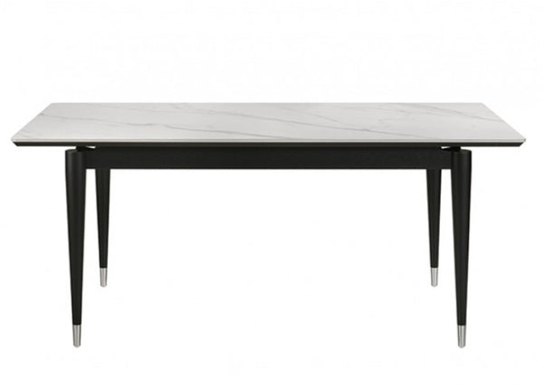Grayson Contemporary Black White Sintered Stone Top Dining Table A modern rectangular dining table with a white marble-look top featuring subtle gray veining and a black metal frame with tapered legs.