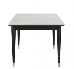 Grayson Contemporary Black White Sintered Stone Top Dining Table A square dining table with a white marble-patterned top and black legs with silver metal tips, shown against a plain white background.