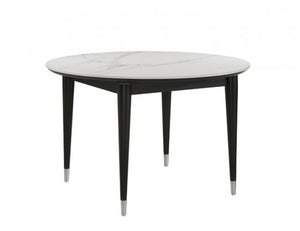 Grayson Contemporary Black White Sintered Stone Top Round Dining Table A round dining table with a white marble-patterned top and four tapered black legs with silver metal tips, shown on a plain white background.