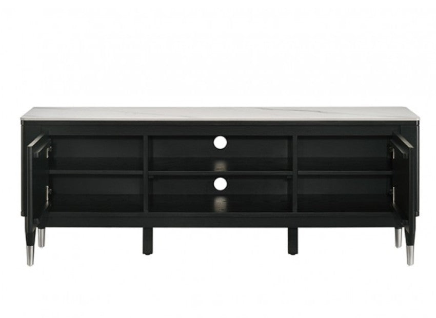 Grayson Contemporary Black White Sintered Stone Top TV Console A modern black TV stand with a white marble-look top and silver metal legs, shown in a styled living room setting with a wall-mounted TV, decorative vases, and a patterned rug.