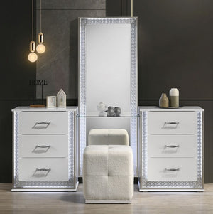 Hailry Glam Modern High Gloss White Finish Vanity Set Pair of mirrored nightstands with decorative elements in a modern bedroom setting.
