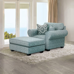 Kumar Rolled Arm Teal Fabric Accent Chair Blue patterned sofa with matching ottoman in a living room setting.