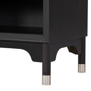 Hermin Modern Style Nightstand Black Close-up of a black cabinet with silver cylindrical feet on a white background
