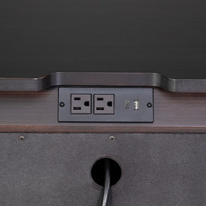 Hermin Modern Style Nightstand Black Close-up of a desk with power outlets and USB port on a dark background