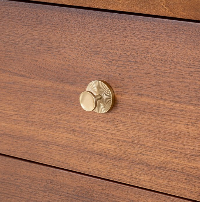 Hermin Modern Style Walnut Dresser Wooden dresser with round mirror and lamp in a room setting