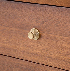 Wooden drawer with a gold knob