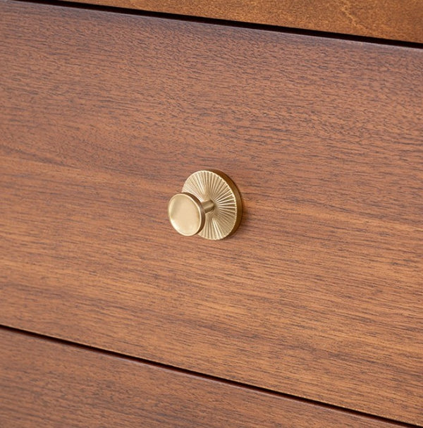 Wooden drawer with a gold knob