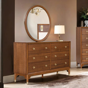 Hermin Modern Style Walnut Dresser Wooden dresser with round mirror and lamp in a room setting