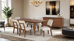 Dining room with wooden table and chairs, sideboard, and artwork on the wall.