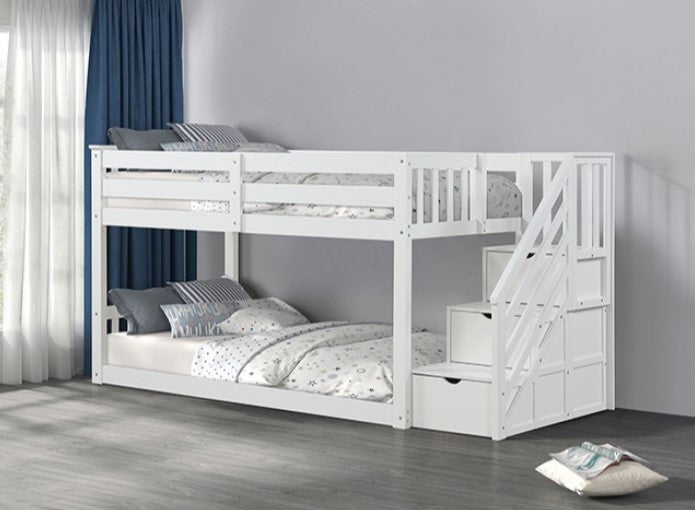 JayJay Solid Pine Storage Slat Design White Bunkbed White bunk bed with a staircase in a room with curtains and pillows.