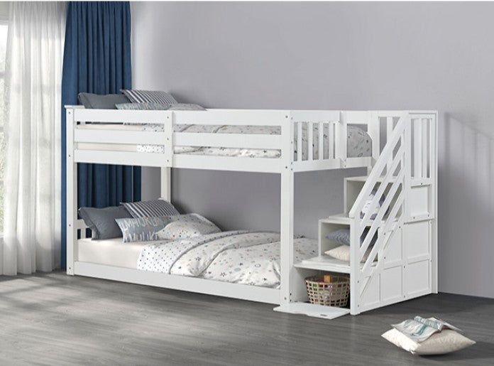 JayJay Solid Pine Storage Slat Design White Bunkbed White bunk bed with a staircase in a room with curtains and pillows.