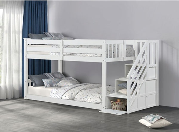 JayJay Solid Pine Storage Slat Design White Bunkbed White bunk bed with a staircase in a room with curtains and pillows.