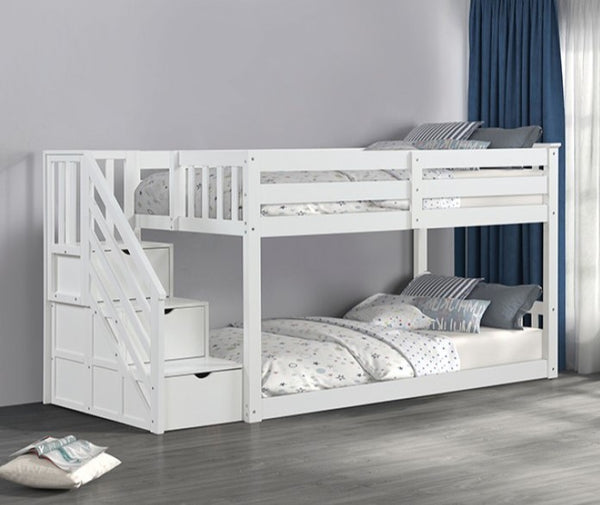 JayJay Solid Pine Storage Slat Design White Bunkbed White wooden bunk bed with stairs in a room with gray walls and a blue curtain.